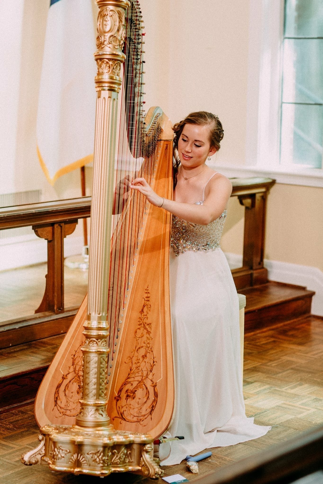 Grace Neal Dudney performing in a white gown